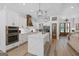 Well-appointed kitchen featuring custom cabinets, quartz countertops, stainless steel appliances, and a farmhouse sink at 11807 Alcovy Rd, Covington, GA 30014