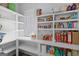 Organized walk-in pantry with built-in shelving, providing ample storage space for all your culinary needs at 11807 Alcovy Rd, Covington, GA 30014