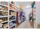 Spacious walk-in closet with custom shelving and ample storage for clothing and accessories at 11807 Alcovy Rd, Covington, GA 30014