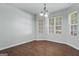 Charming dining area features wood floors, neutral paint, and a stylish chandelier at 11439 South Grove Dr, Hampton, GA 30228