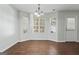 Bright dining area with wood floors, bay windows and ample natural light at 11439 South Grove Dr, Hampton, GA 30228