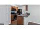Functional kitchen with essential appliances and countertop seating offers a cozy cooking space at 11439 South Grove Dr, Hampton, GA 30228