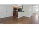 Open-concept kitchen with modern appliances, and wood floors at 11439 South Grove Dr, Hampton, GA 30228