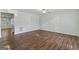Spacious living room boasts beautiful hardwood floors, ceiling fan, and ample natural light at 11439 South Grove Dr, Hampton, GA 30228