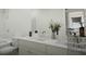 Bright bathroom with double vanity, white countertops, and a modern design with a bathtub at 1217 Trombone Way # 6, Mcdonough, GA 30252