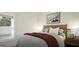 Bright bedroom showcasing a comfortable bed near a sunlit window, creating a cozy retreat at 1217 Trombone Way # 6, Mcdonough, GA 30252