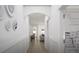 This is a hallway featuring wainscoting, neutral tones, and an arched entry at 1217 Trombone Way # 6, Mcdonough, GA 30252