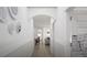 This is a hallway featuring wainscoting, neutral tones, and an arched entry at 1217 Trombone Way # 6, Mcdonough, GA 30252