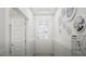 This is a hallway featuring wainscoting, neutral tones, and an arched entry at 1217 Trombone Way # 6, Mcdonough, GA 30252