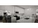 Stylish kitchen with stainless steel appliances, white cabinetry, and a center island at 1217 Trombone Way # 6, Mcdonough, GA 30252