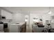 Open-concept kitchen and living area with an island and modern appliances at 1217 Trombone Way # 6, Mcdonough, GA 30252
