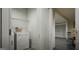 Efficient laundry room with modern washer and dryer, complemented by overhead shelving for storage at 1217 Trombone Way # 6, Mcdonough, GA 30252