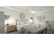 This is a view of the spacious main bedroom, with a stylish ceiling fan, artwork and neutral-toned furnishings at 1217 Trombone Way # 6, Mcdonough, GA 30252