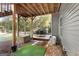 Covered back patio with an outdoor dining area, perfect for relaxation and entertainment at 1412 Short Ct, Mcdonough, GA 30252