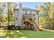 Expansive backyard featuring a deck, patio, and lush green lawn ideal for outdoor enjoyment at 1412 Short Ct, Mcdonough, GA 30252