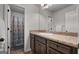 Bright bathroom featuring tiled floors, a large mirror, and shower with curtain at 1412 Short Ct, Mcdonough, GA 30252