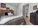 Cozy bedroom featuring a wood bed frame, carpeted floors, and neutral wall paint at 1412 Short Ct, Mcdonough, GA 30252