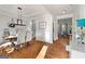 Elegant dining room featuring hardwood floors, tray ceiling, and modern lighting fixture at 1412 Short Ct, Mcdonough, GA 30252