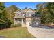 Inviting two-story home with brick accents, manicured lawn, and a spacious two-car garage at 1412 Short Ct, Mcdonough, GA 30252