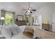 Well-lit main bedroom with a vaulted ceiling, plush bedding, and view of a separate sitting area at 1412 Short Ct, Mcdonough, GA 30252