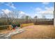 Large backyard with seating and lush lawn at 1690 Geranium Ln, Cumming, GA 30040
