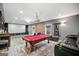 Finished basement with pool table, media screen and bar area at 1690 Geranium Ln, Cumming, GA 30040