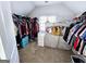 Walk-in closet with built in storage and natural light at 1690 Geranium Ln, Cumming, GA 30040