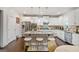 Modern kitchen with stainless steel appliances, brick island, and counter seating at 1690 Geranium Ln, Cumming, GA 30040