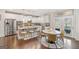 Spacious kitchen with stainless steel appliances, white cabinets, and granite countertops at 1690 Geranium Ln, Cumming, GA 30040