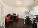 Well-lit home office features wood floors, crown moulding, and multiple work spaces at 1690 Geranium Ln, Cumming, GA 30040