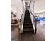 View of a staircase with modern iron spindles leading to the second floor at 1690 Geranium Ln, Cumming, GA 30040