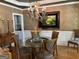 The formal dining room is equipped with a chandelier and stylish furniture at 245 River Laurel Way, Woodstock, GA 30188