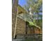 The brick exterior of the home has a chimney and an elevated, covered porch at 245 River Laurel Way, Woodstock, GA 30188