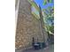 The brick exterior of the home includes air conditioning units and a chimney at 245 River Laurel Way, Woodstock, GA 30188
