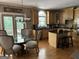 Eat-in kitchen featuring custom cabinets, granite countertops, and access to deck at 245 River Laurel Way, Woodstock, GA 30188