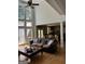 Cozy living area with hardwood floors leading to the kitchen with an island at 245 River Laurel Way, Woodstock, GA 30188