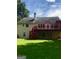 Exterior of a home with a well-maintained lawn and a deck at 436 Abbey Pl, Villa Rica, GA 30180
