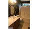 Decorated bathroom with patterned wallpaper, a vanity with double sinks, toilet, and shower over tub at 436 Abbey Pl, Villa Rica, GA 30180