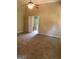 Large bedroom with neutral walls and carpets, fan, and ensuite access at 436 Abbey Pl, Villa Rica, GA 30180