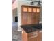 Kitchen island with black countertop, tiled floor and views to living room at 436 Abbey Pl, Villa Rica, GA 30180