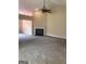 Spacious living room with neutral carpet, fireplace and fan at 436 Abbey Pl, Villa Rica, GA 30180