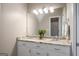 Elegant bathroom featuring a double vanity, decorative lighting, and neutral tones at 692 Brooks Woolsey Rd, Brooks, GA 30205