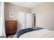 Bedroom features a dark wood dresser, soft lighting, and a serene, relaxing atmosphere at 692 Brooks Woolsey Rd, Brooks, GA 30205