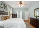 Bright bedroom featuring two dressers, natural lighting, and hardwood floors at 692 Brooks Woolsey Rd, Brooks, GA 30205