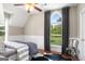 Bedroom featuring a window with views, decorative ceiling fan and dark wood floors at 692 Brooks Woolsey Rd, Brooks, GA 30205