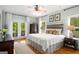 Charming bedroom with hardwood floors, and French doors leading to the outside at 692 Brooks Woolsey Rd, Brooks, GA 30205