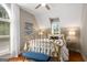 Comfortable bedroom featuring a brass bed, natural light, and tasteful decor at 692 Brooks Woolsey Rd, Brooks, GA 30205