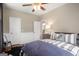 Comfortable bedroom with wainscoting, a view from the window and dark wood floors at 692 Brooks Woolsey Rd, Brooks, GA 30205