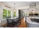 Cozy dining area featuring natural light, dark wood table, and rustic accents at 692 Brooks Woolsey Rd, Brooks, GA 30205