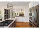 Open concept kitchen showcasing stainless appliances, granite counters and open view to living area at 692 Brooks Woolsey Rd, Brooks, GA 30205